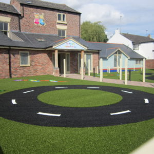 Roadway in black artificial grass