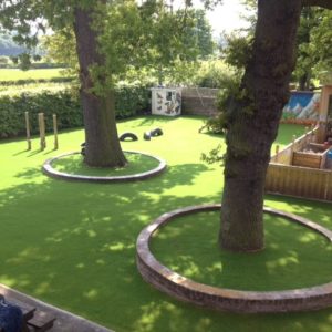 Artificial grass around trees