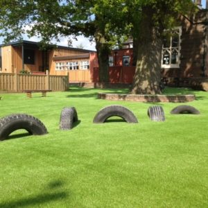 Artificial grass installed around tyres